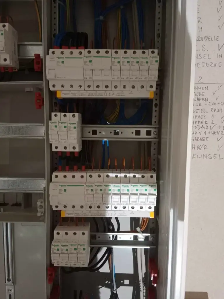 Connected residential electric panel with Schneider circuit breakers and labeled circuits