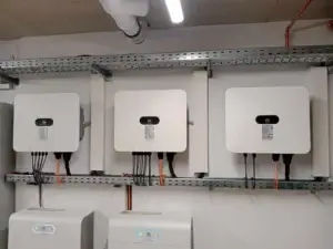 Close-up of Huawei inverters connected to an indoor photovoltaic system
